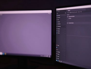 Close-up of a digital workspace with elegant UI elements, soft purple glow from screens, cinematic dark lighting.