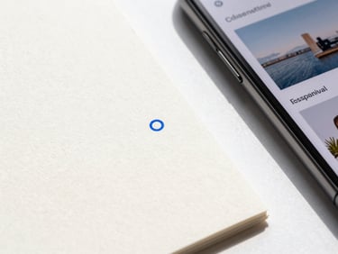 Macro flat lay of textured heavy-weight paper stocks with embossed electric blue ink details next to a sleek modern smartphone showing a responsive website layout, bright natural studio light, clean sharp shadows