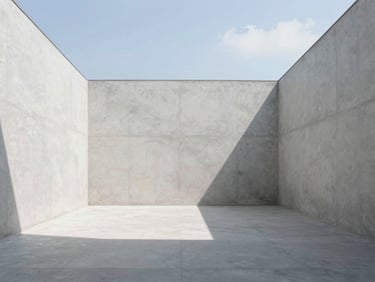 Symmetrical architectural photography of a minimalist interior space with clean concrete walls and natural light.