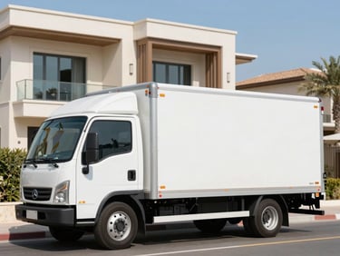 A clean, branded white moving truck parked outside a luxury modern villa in Al Barsha under bright blue skies.
