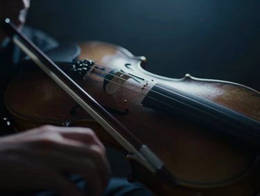 Dramatic chiaroscuro close-up of violin bows in motion, catching soft atmospheric backlighting, deep midnight blue tones, soft focus.