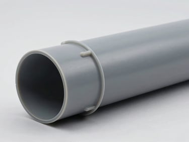 Gray PVC cable trunking on a clean background, showing a self-extinguishing profile, technical studio lighting.