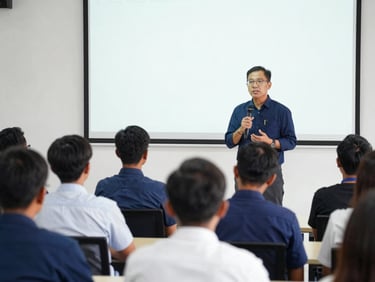 An academic seminar scene in Indonesia, speaker presenting with a clean slide background, professional audience listening attentively.