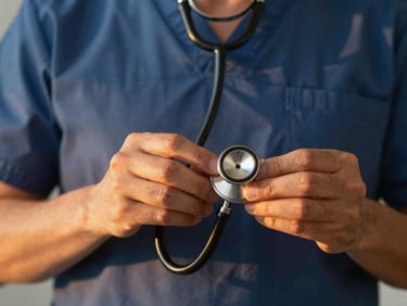Close-up of a medical professional's hands holding a stethoscope, warm golden-hour lighting, shallow depth of field, 35mm