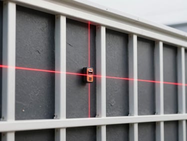 Video player interface overlay showing a laser level casting a bright red grid on a metal wall frame