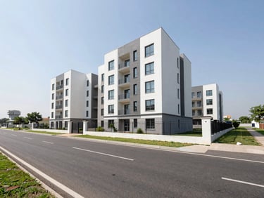 Newly constructed independent floors and modern apartment buildings on Golf Course Extension Road, Gurugram, clean asphalt road, clear skies.