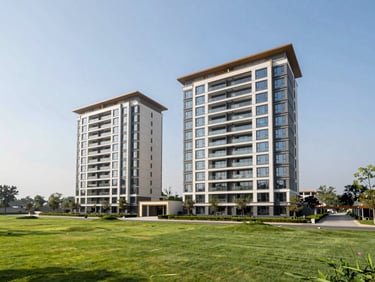 Modern luxury high-rise apartment complex on Golf Course Road, Gurugram, bright daylight, manicured green landscape in front.