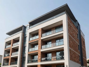 Modern residential building facade in Sushant Lok 1, Gurugram, featuring contemporary architecture, clean brick and glass elements, daytime.