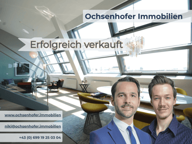 Ochsenhofer Immobilien real estate agents in a bright modern penthouse apartment successfully sold.