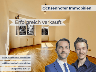 Empty apartment sold by Ochsenhofer Immobilien real estate agents in Austria with parquet flooring.