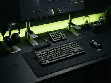 High-tech minimalist desktop accessories on a dark matte desk, illuminated by cyber lime neon ambient light, sharp details.