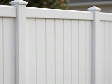 Smooth, clean white vinyl privacy fence section, showing weather-resistant material texture, under bright morning daylight.