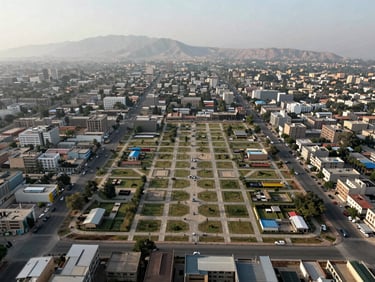 Daylight exterior shot of a CDA-approved sector in Islamabad, wide environmental frame showing plotted development and street grid, Margalla Hills faintly visible in background, morning light, documentary style