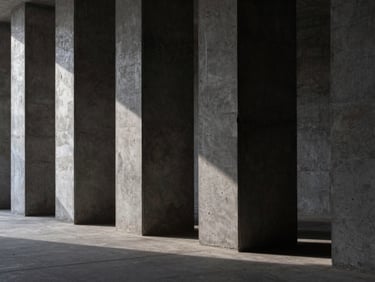 Abstract architectural perspective of dark, heavy-weight concrete pillars casting deep, geometric shadows under a single low-key light source.