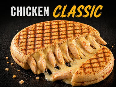 Grilled classic chicken TOASTIS sandwich with melted cheese pull on a dark background.