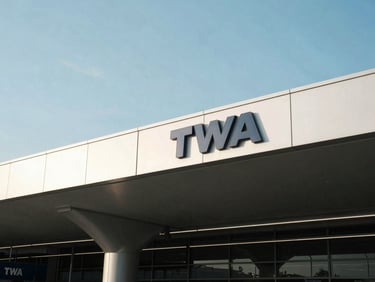 Architectural shot of the modern TWA terminal at JFK airport, clean lines, morning light, 35mm