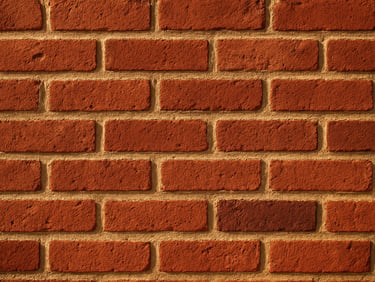 Close-up of hand-laid red brickwork on a residential facade, warm Mississippi afternoon light casting soft shadows, sharp depth of field