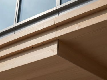 Close-up of linear wood lambrines with precise joints, soft shadow lines, architectural detail, crisp daylight.