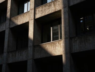 Brutalist concrete architecture in London, sharp geometric shadows, high-contrast low-key lighting, moody editorial