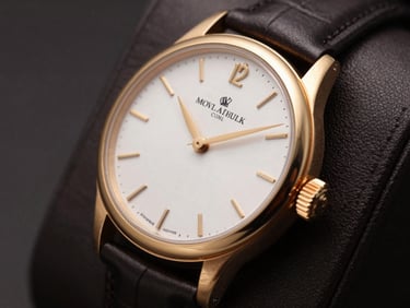 Close-up of a classic luxury watch with gold accents on a dark leather background, high contrast, elegant lighting