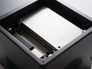 Clean physical server hardware close-up, sharp defined shadows, high-key bright studio light, crisp metallic textures.