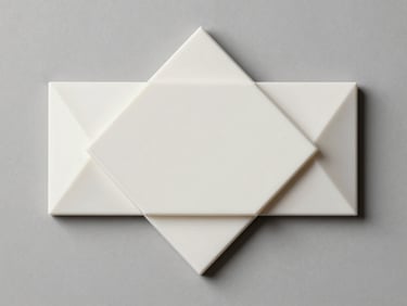 Overhead flat-lay of a custom 3D-printed home decor piece — a geometric wall ornament or nameplate — on a neutral grey surface under studio strobe lighting, clean edges and surface finish clearly visible
