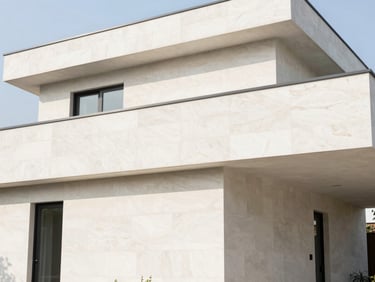 Bright modern home exterior with clean masonry, soft natural daylight, straight architectural lines, 35mm lens