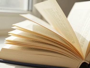 Close-up of beautifully textured book pages, warm natural daylight, 35mm.