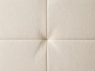 Close-up flat-lay of clean cream linen upholstery fabric texture, stitching detail visible, shot directly downward in soft natural daylight, no people, no equipment