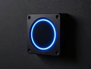 Extreme close-up of a flush-mounted smart lighting controller installed on a dark matte wall, neon-blue capacitive touch ring illuminated precisely, surrounding architectural darkness, studio strobe side-lighting revealing the device's precise machined edges, no human subject, high-contrast dramatic framing