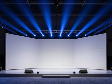 Wide-angle view of an exhibition stage design, dramatic cobalt spotlights, clean geometric panels, high-tech corporate aesthetic.