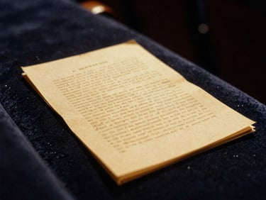 Close-up of a vintage stage script resting on a velvet theatre seat, golden spotlight illuminating the pages, shallow depth of field, 35mm film.