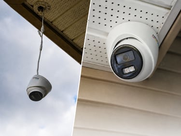 Hardwired CCTV security cameras mounted under a home roofline by Pinnacle Security Solutions