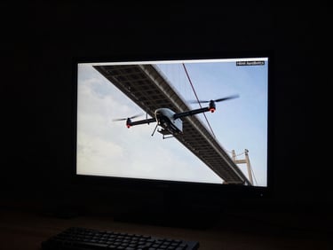 High-altitude thermal imaging feed displayed on a monitor, showing a bridge under inspection by a Hilmi AeroBotics UAV, with telemetry data overlaid, low-key dramatic studio lighting, 85mm