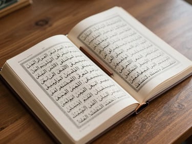 Close-up overhead of an open Arabic Quran resting on a wooden desk surface, pages crisp and clearly printed, a wooden bookmark to the side, natural window light casting soft shadows, no hands visible