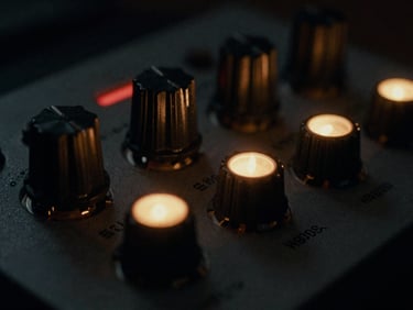 Extreme close-up of a vintage tube compressor with glowing indicator lights, moody analog photography, deep shadows, 35mm film grain, tactile texture