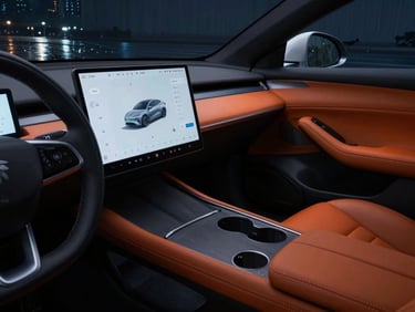 Cinematic interior detail of a premium electric sedan, focus on leather stitching and clean digital console, dramatic low-key night lighting