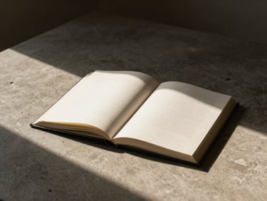 Editorial photography, architectural book open on a concrete desk, dramatic shadows, warm beige tones