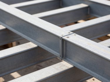 Sharp macro detail of heavy steel beam joinery on an active construction site, high-contrast structural framing, 35mm