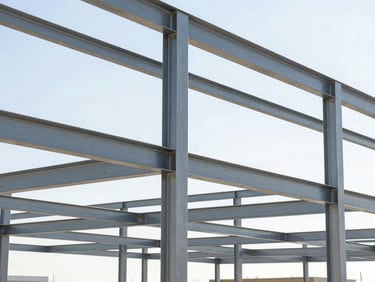 Sharp architectural photography of structural steel framing on a bright Utah afternoon, clean lines, high-contrast shadows, 35mm.
