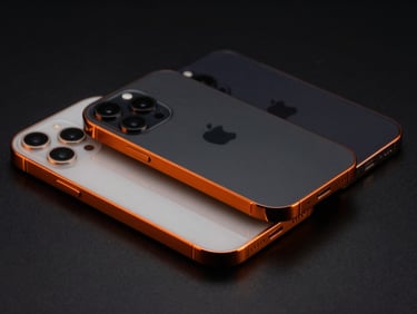 Sleek studio shot of three pristine iPhones arranged diagonally, high-contrast orange rim highlights, deep black background, sharp focus