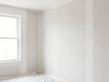 Bright architectural photography of meticulous drywall repair with clean sanding lines, painter prepping a wall with canvas drop cloths below, clean natural window light, crisp high-contrast tones, sharp focus, 35mm