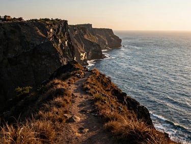 A wide-angle shot of the dramatic Gokarna cliffs overlooking the blue ocean at golden hour, a narrow dirt trail winding along the ridge, warm cinematic lighting.