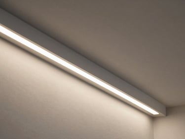 Detail shot of recessed LED strip profile installed in a drywall ceiling cove, linear light emitting along a precise channel, controlled daylight ambient, no decorative staging