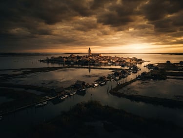 Wide cinematic drone shot of Marano Lagunare lagoon at golden hour, low-key dramatic lighting, deep shadows, rich ochre and charcoal tones, 35mm anamorphic lens