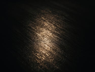 Abstract light refractions on a dark surface, cinematic, gunmetal textures, dramatic chiaroscuro, anamorphic lens, 35mm