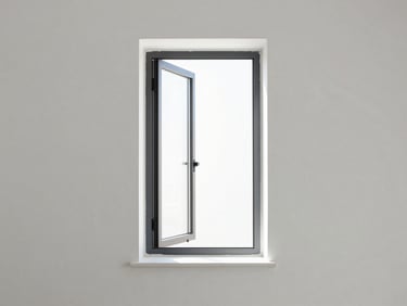 Minimalist casement window open slightly, soft morning light filtering through, clean white plaster wall background