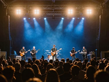 Wide concert stage view, musicians in the zone under deep blue lights, crowd silhouettes, 16:9 aspect ratio