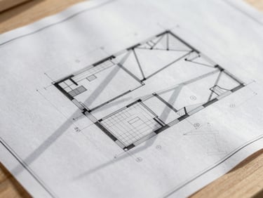 Close-up of architectural blueprint overlaid on a timber surface, with drafting tools, sharp geometric shadows, 35mm