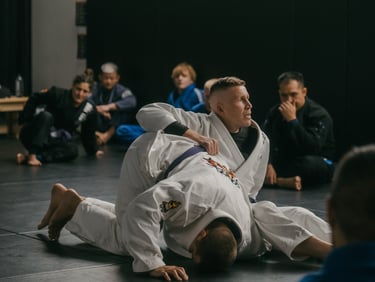 Jared demonstrating an omoplata during adult BJJ class